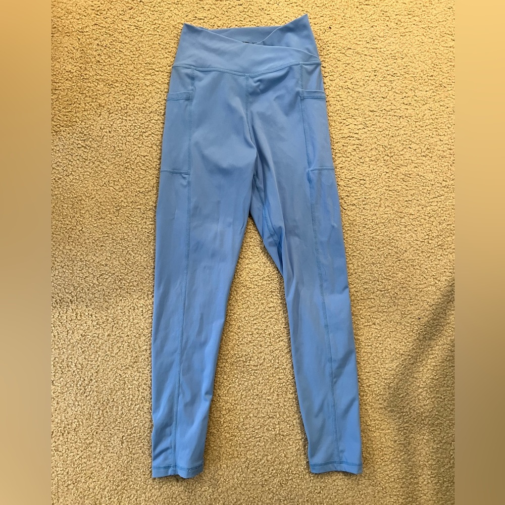 Very gently worn (once or twice) Cara Loren Active blue cross front leggings